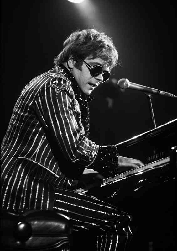 Elton John playing piano | Metal Poster